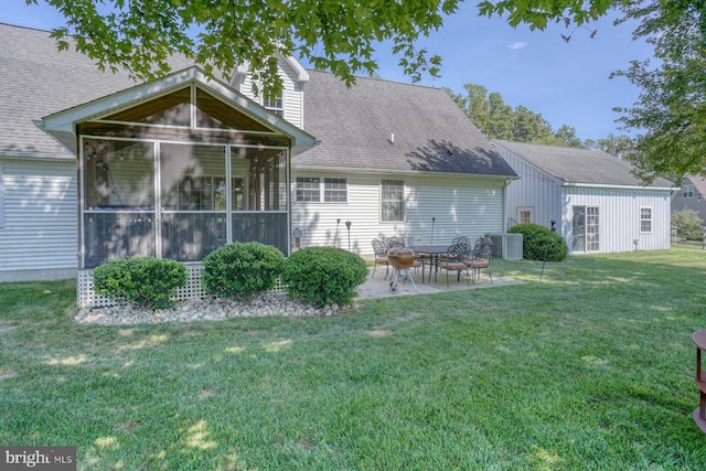 18418 Gravel Hill Rd, Georgetown, DE 19947 - back of property featuring a sunroom, a yard, a patio area, cooling unit, and a shingled roof