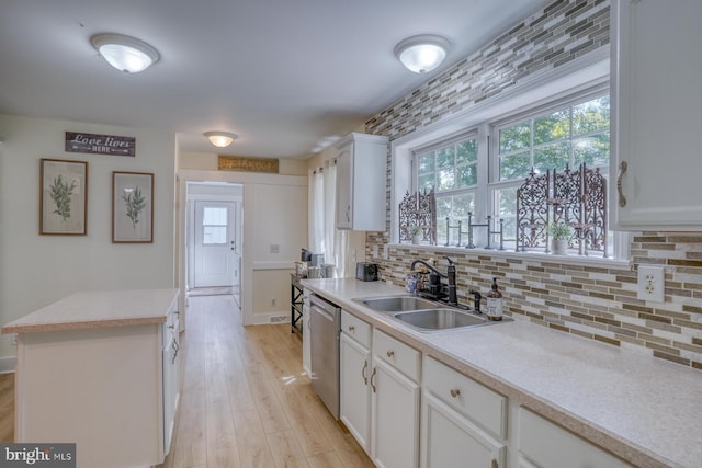 18418 Gravel Hill Rd, Georgetown, DE 19947 - kitchen featuring a sink, dishwasher, backsplash, white cabinets, and light countertops