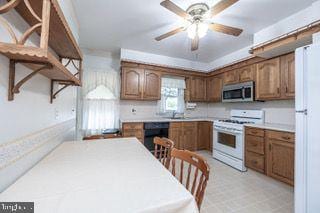 kitchen with white appliances, ceiling fan, light countertops, and brown cabinets