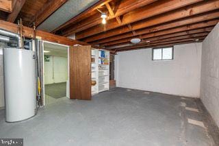 below grade area featuring water heater