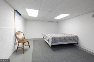 bedroom with a paneled ceiling