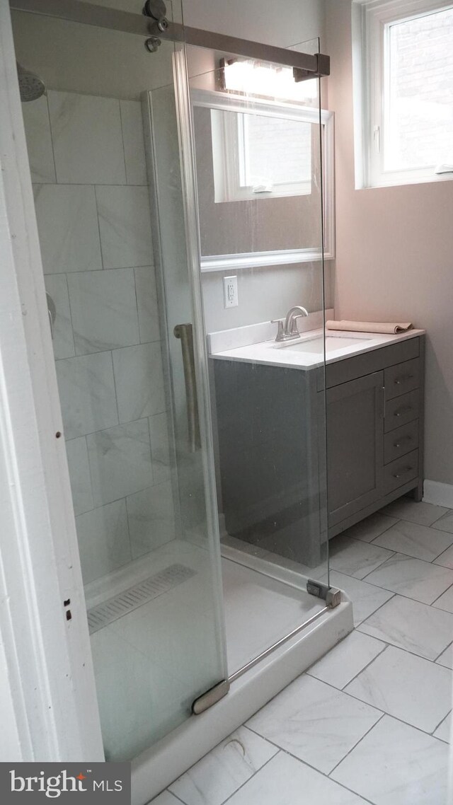 2236 Linden Ave, Baltimore, MD 21217 - full bath with a shower stall, vanity, and marble look tiles