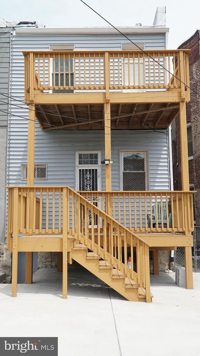 2236 Linden Ave, Baltimore, MD 21217 - rear view of house featuring a balcony and a carport