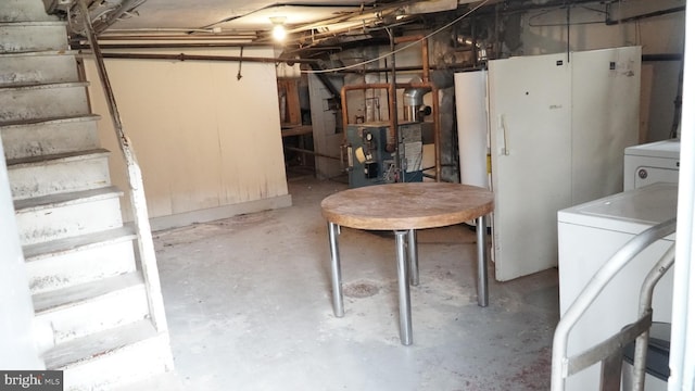 2236 Linden Ave, Baltimore, MD 21217 - unfinished basement with washer / clothes dryer, a heating unit, and stairs