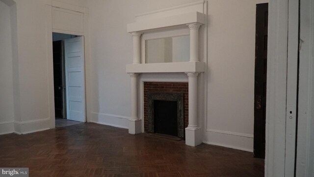 2236 Linden Ave, Baltimore, MD 21217 - unfurnished living room featuring a fireplace and baseboards