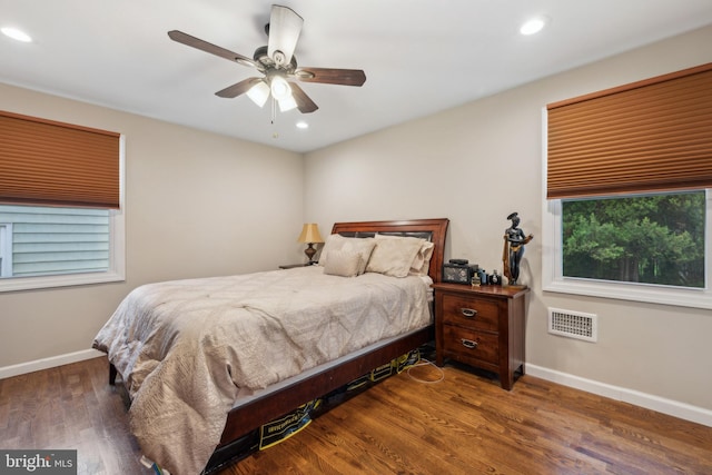 bedroom with baseboards, recessed lighting, wood finished floors, and a ceiling fan