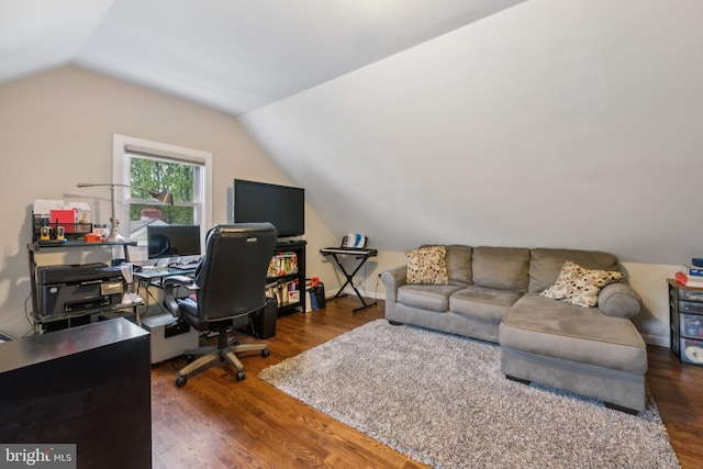office space featuring lofted ceiling and wood finished floors