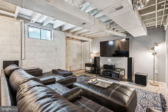 living room featuring concrete block wall
