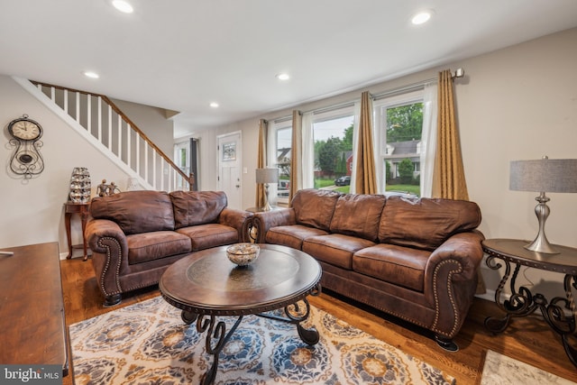 living room with stairs, wood finished floors, and recessed lighting
