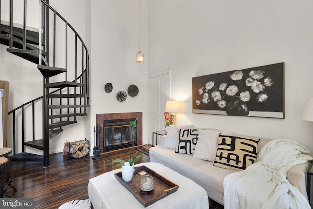 1019 Summerglenn Ct Unit 7-302, Bowie, MD 20721 - living room with wood finished floors, a high ceiling, stairs, and a glass covered fireplace