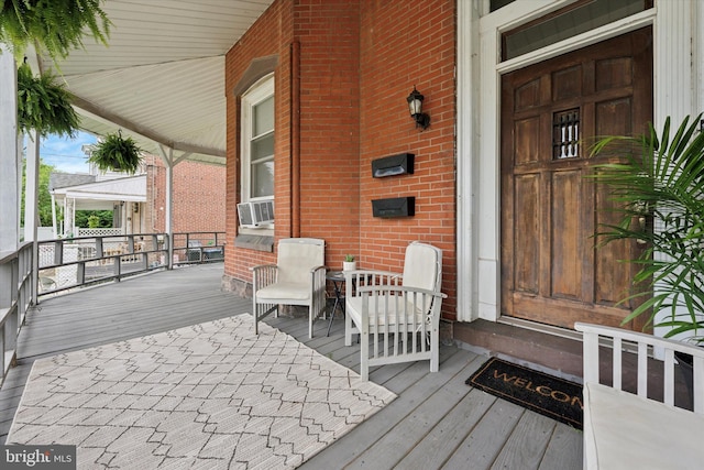 wooden porch with cooling unit