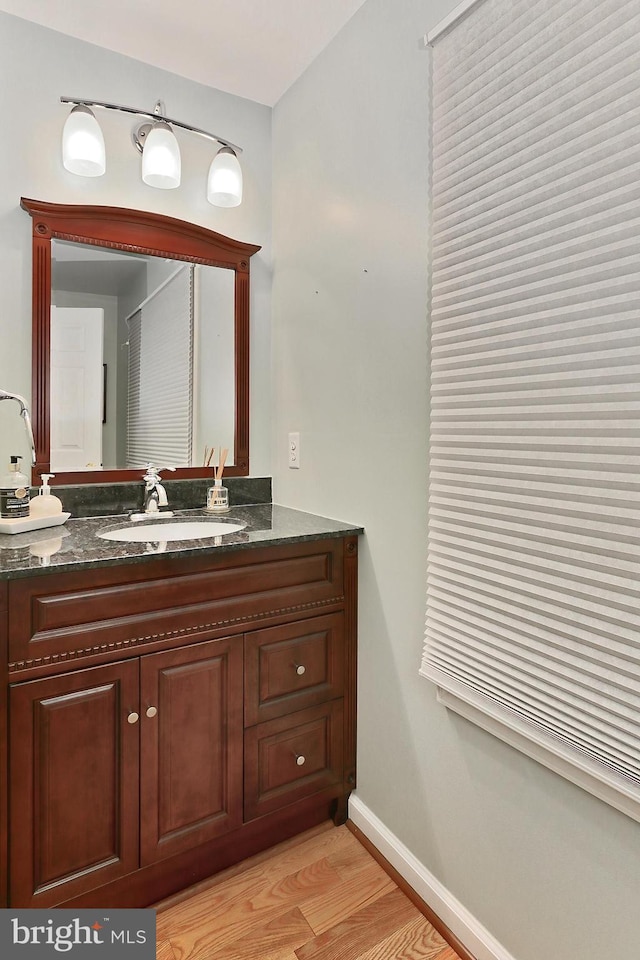 4501 Highland Green Ct, Alexandria, VA 22312 - bathroom with wood finished floors, baseboards, and vanity