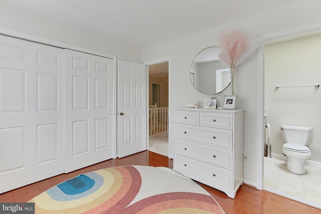 4501 Highland Green Ct, Alexandria, VA 22312 - bedroom with wood finished floors, a closet, and ensuite bathroom