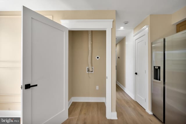 hall with light wood finished floors, baseboards, and recessed lighting