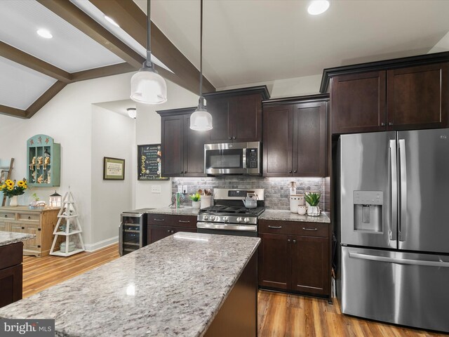 20 Parker Dr, Millsboro, DE 19966 - kitchen with appliances with stainless steel finishes, light wood finished floors, light stone countertops, decorative backsplash, and dark brown cabinets