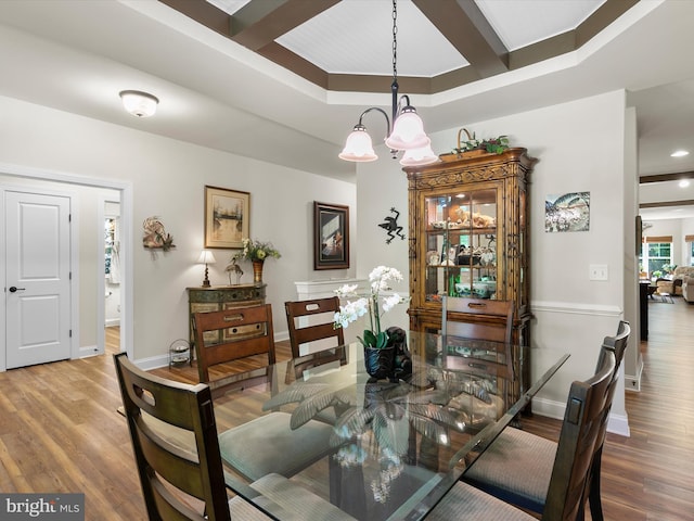 20 Parker Dr, Millsboro, DE 19966 - dining room with wood finished floors, a chandelier, baseboards, coffered ceiling, and beamed ceiling
