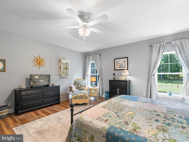 20 Parker Dr, Millsboro, DE 19966 - bedroom featuring multiple windows, wood finished floors, and a ceiling fan