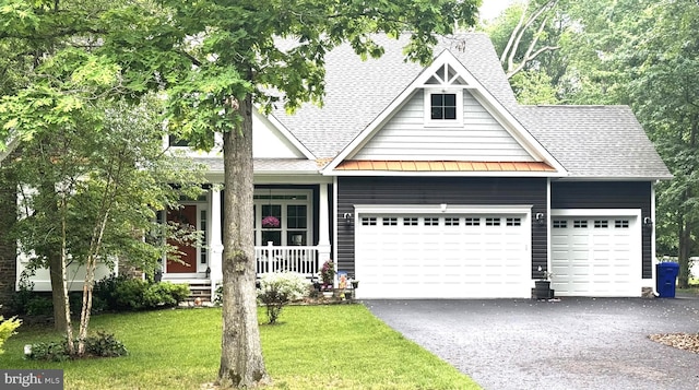 20 Parker Dr, Millsboro, DE 19966 - craftsman house featuring a shingled roof, an attached garage, driveway, a standing seam roof, and a porch