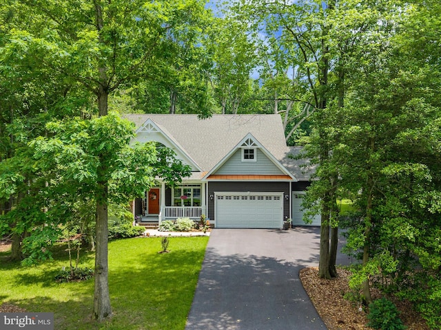 20 Parker Dr, Millsboro, DE 19966 - view of front facade featuring driveway, a garage, a front yard, covered porch, and a shingled roof