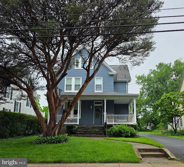 3113 White Ave, Baltimore, MD 21214 - view of front facade featuring a front yard and covered porch