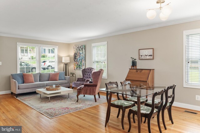 23 Linden Ave, Annapolis, MD 21401 - living area featuring crown molding, light wood-style floors, healthy amount of natural light, and baseboards