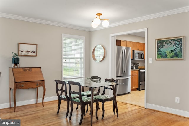 23 Linden Ave, Annapolis, MD 21401 - dining area with crown molding, light wood-style flooring, baseboards, and a chandelier