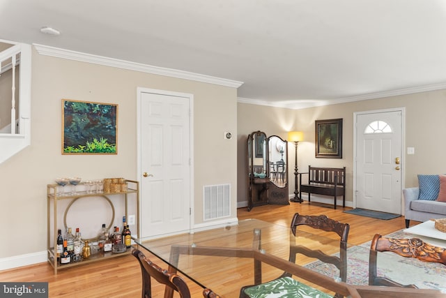 23 Linden Ave, Annapolis, MD 21401 - living area with light wood-style floors, crown molding, and baseboards