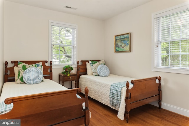 23 Linden Ave, Annapolis, MD 21401 - bedroom with multiple windows, wood finished floors, and baseboards