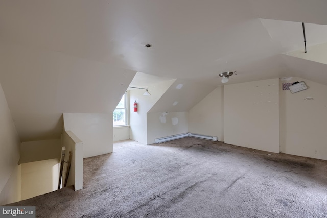 bonus room featuring vaulted ceiling, carpet floors, and a baseboard radiator