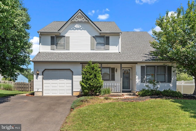 407 Stanford Rd, Fairless Hills, PA 19030 - view of front facade featuring a porch, a garage, roof with shingles, and asphalt driveway