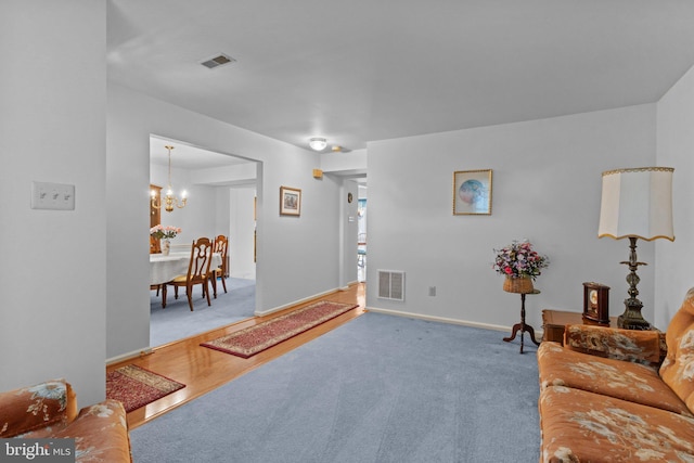 407 Stanford Rd, Fairless Hills, PA 19030 - carpeted living area featuring a chandelier and baseboards