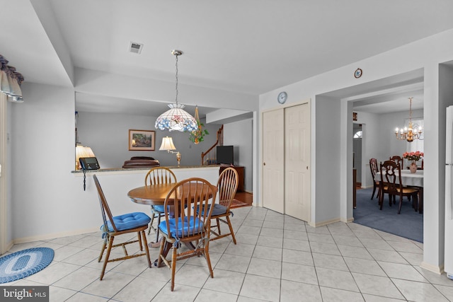 407 Stanford Rd, Fairless Hills, PA 19030 - dining area featuring a chandelier, baseboards, and light tile patterned flooring