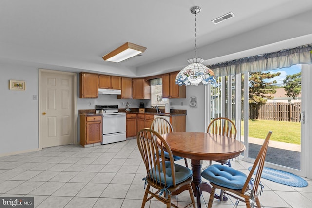 407 Stanford Rd, Fairless Hills, PA 19030 - kitchen featuring white range with electric stovetop, under cabinet range hood, dark countertops, and a sink