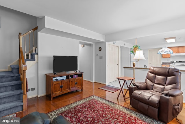 407 Stanford Rd, Fairless Hills, PA 19030 - living room with wood finished floors, stairway, and baseboards