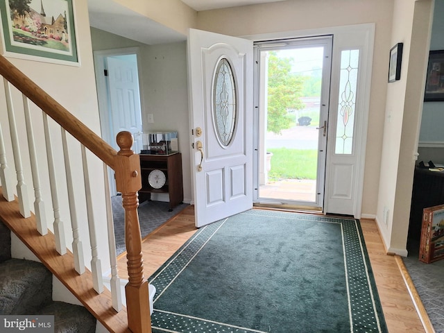 839 Shore Dr, Edgewater, MD 21037 - entryway with light wood-type flooring, stairs, and baseboards