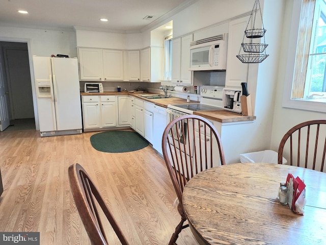 839 Shore Dr, Edgewater, MD 21037 - kitchen with white appliances, a sink, white cabinetry, light wood-type flooring, and wood counters