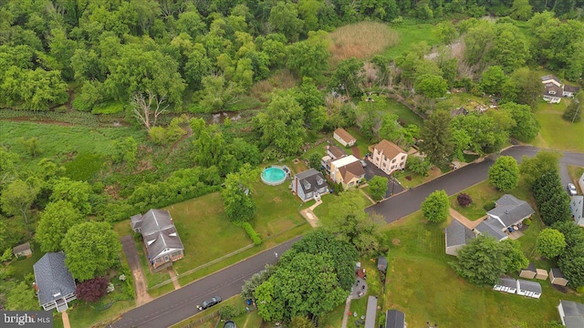 aerial view of property's location with nearby suburban area