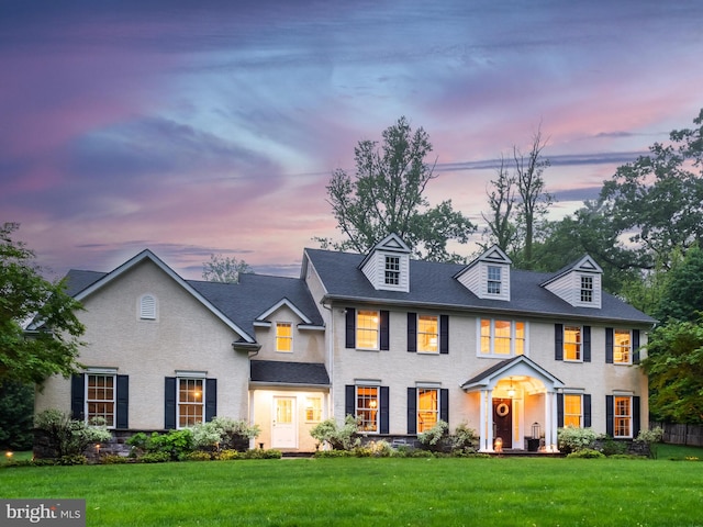 colonial house featuring a front yard
