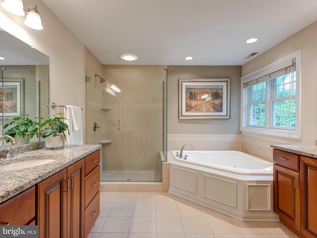 full bathroom with a shower stall, vanity, tile patterned flooring, a bath, and recessed lighting
