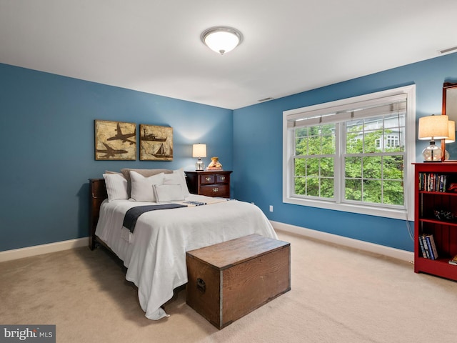 bedroom featuring carpet flooring and baseboards