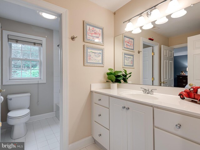 full bathroom featuring tile patterned floors, vanity, toilet, and baseboards