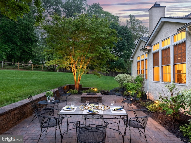 view of patio with a fire pit