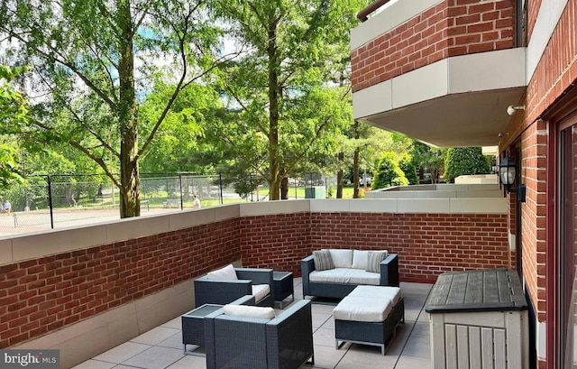 2301 N St NW Unit 101, Washington, DC 20037 - view of patio featuring an outdoor hangout area, fence, and view of scattered trees