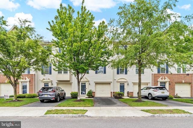 128 Michele Way Unit 38, Cinnaminson, NJ 08077 - view of property with a garage, driveway, and brick siding