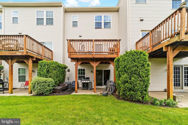 128 Michele Way Unit 38, Cinnaminson, NJ 08077 - rear view of house featuring a patio, a lawn, cooling unit, and a wooden deck