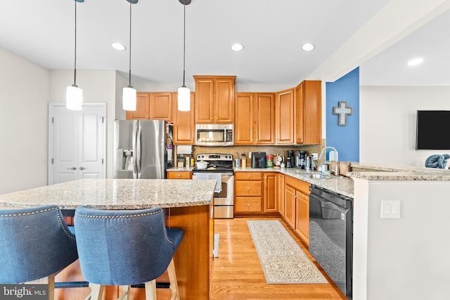 128 Michele Way Unit 38, Cinnaminson, NJ 08077 - kitchen with appliances with stainless steel finishes, a sink, light wood-style flooring, decorative backsplash, and light stone counters
