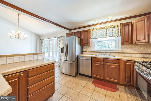 147 Heather Rd, Haddon Township, NJ 08107 - kitchen featuring appliances with stainless steel finishes, a sink, decorative backsplash, a chandelier, and light countertops