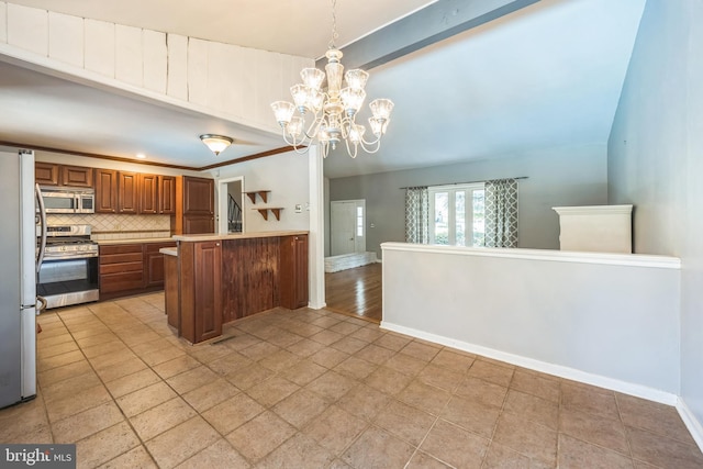 147 Heather Rd, Haddon Township, NJ 08107 - kitchen featuring stainless steel appliances, a chandelier, a peninsula, brown cabinetry, and backsplash