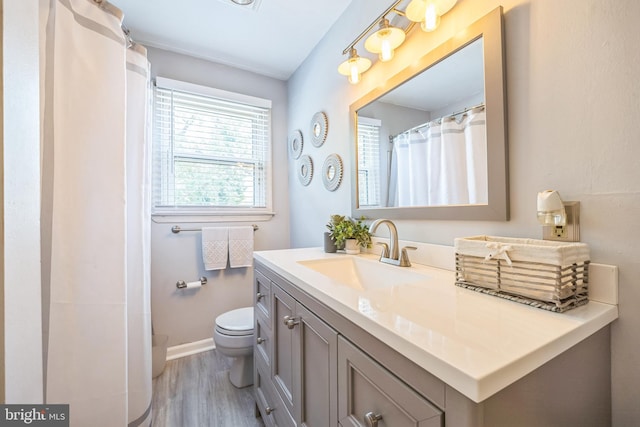 147 Heather Rd, Haddon Township, NJ 08107 - full bathroom featuring vanity, wood finished floors, toilet, and baseboards