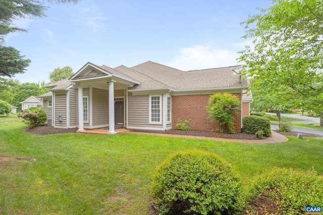 1269 Townbrook Xing, Charlottesville, VA 22901 - view of front of house featuring a front lawn, roof with shingles, and brick siding